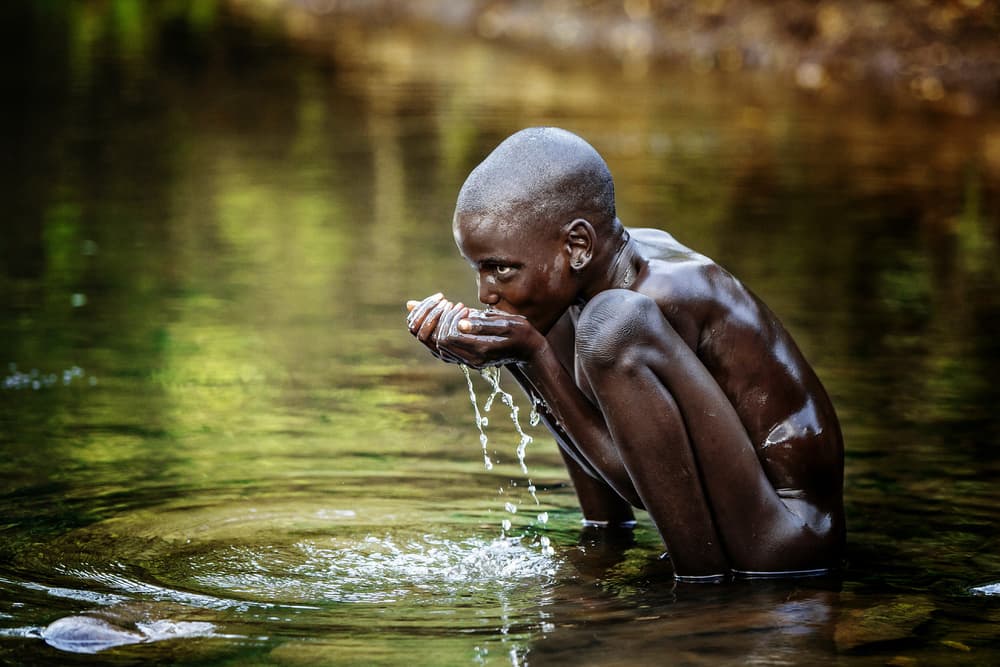 Boy Drinking Water by Vedran Vidak — canvas wall art