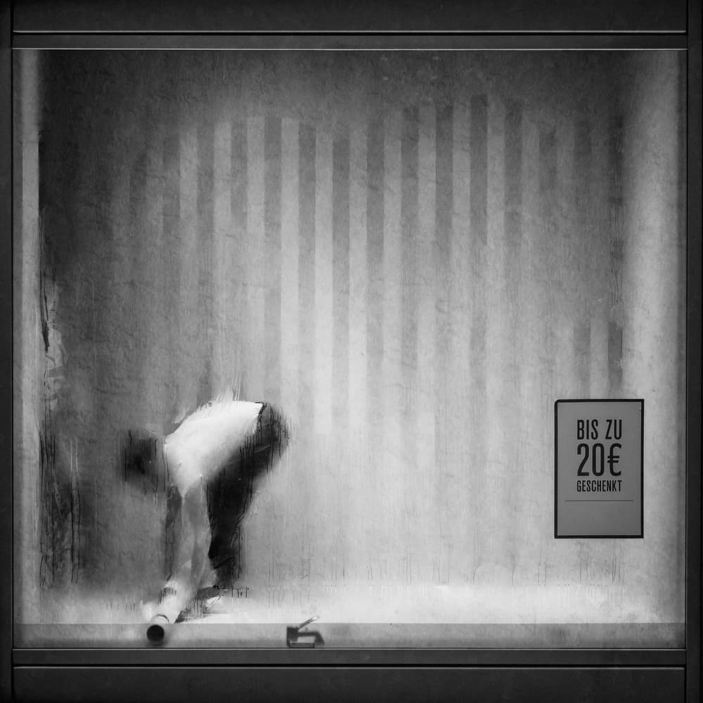 Man In Blurred Shop Window by Roswitha Schleicher-Schwarz — canvas wall art