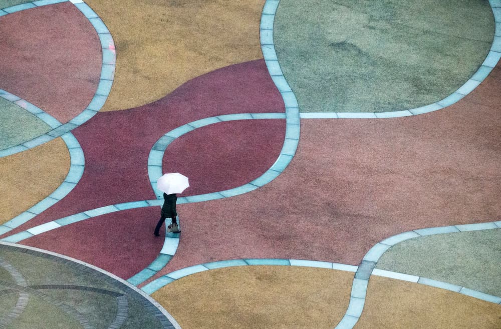 Solitary Umbrella Stroll by C.S. Tjandra — canvas wall art