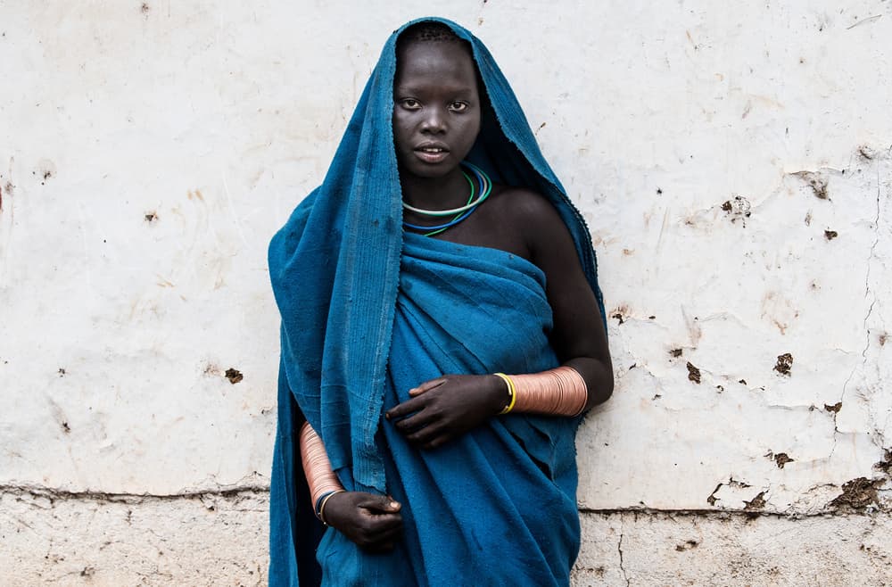 African Woman In Blue by Joxe Inazio Kuesta Garmendia — canvas wall art