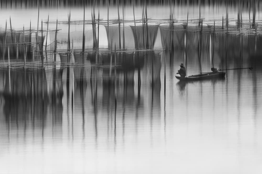 Quiet Fishing Reflections by Ekkachai Khemkum — canvas wall art