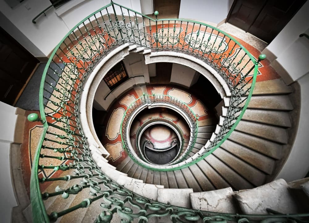 Grand Ornate Spiral Staircase by Renate Reichert — canvas wall art