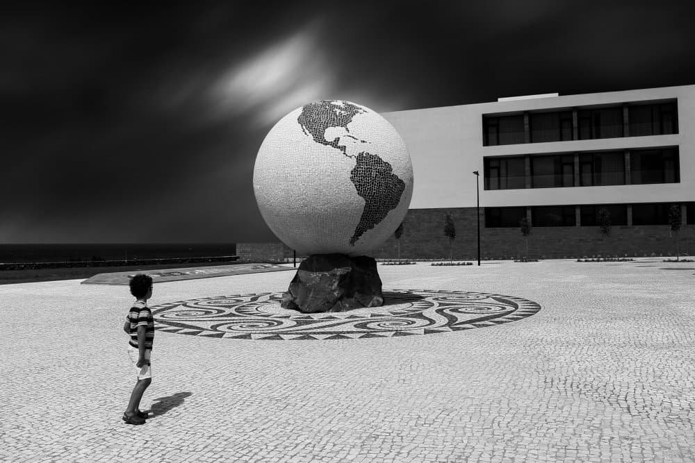 Boy and Giant Globe by Paulo Medeiros — canvas wall art