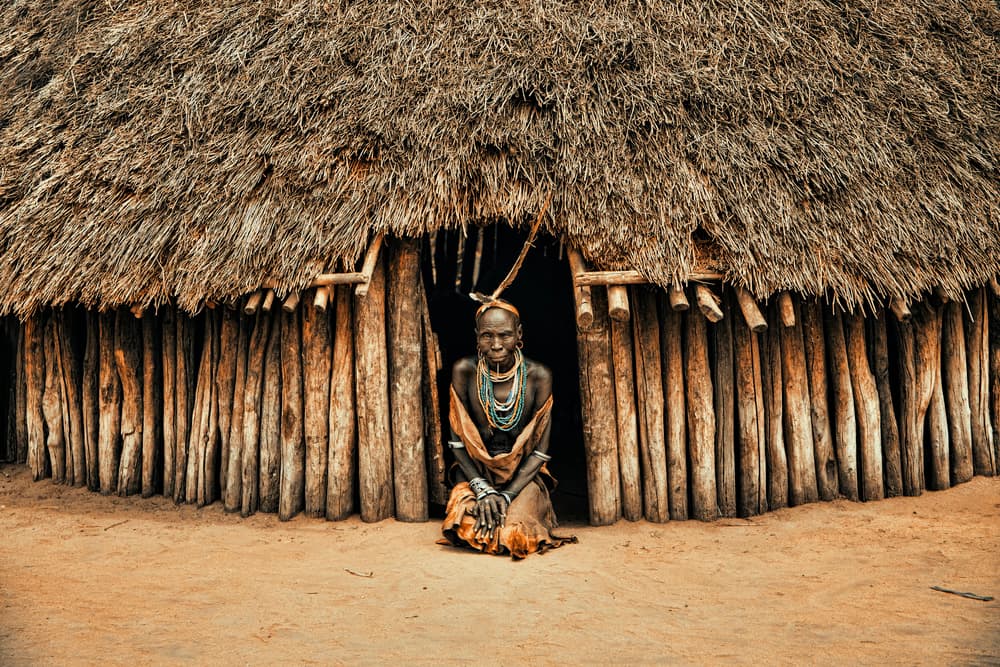 Tribal Woman at Hut by Svetlin Yosifov — canvas wall art