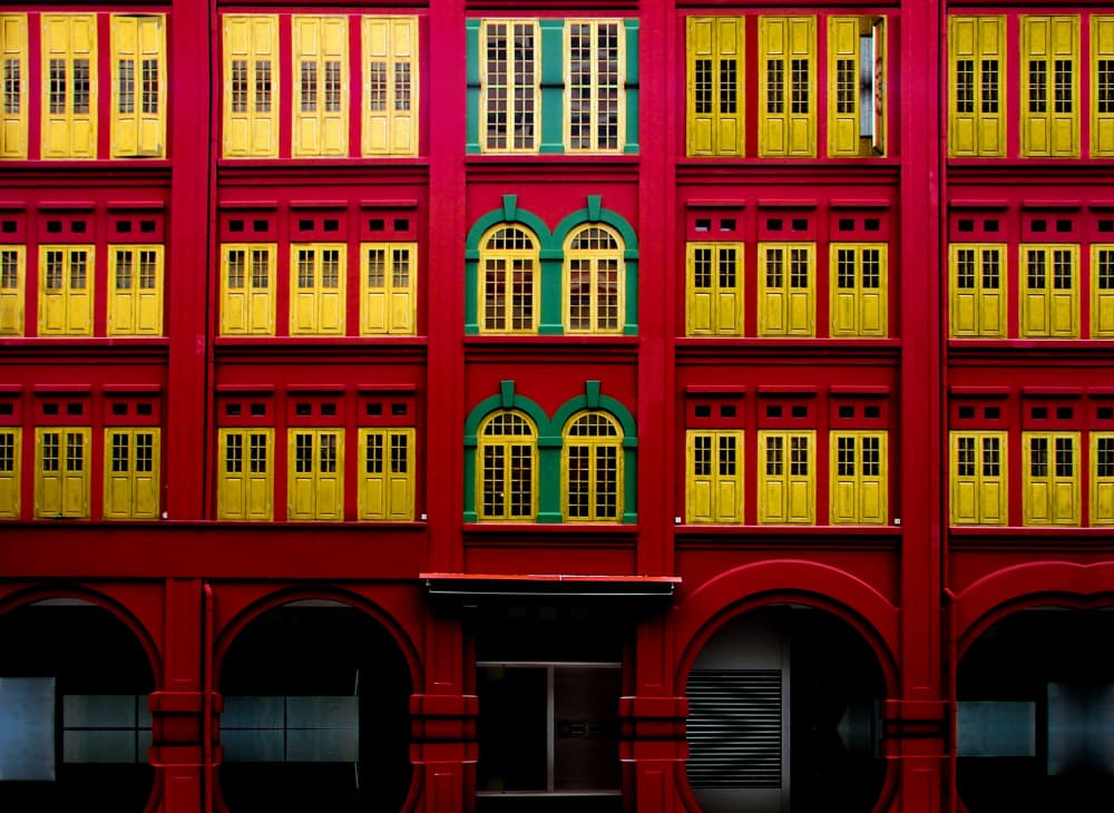 Vibrant Red Building Facade by Miro Susta — canvas wall art