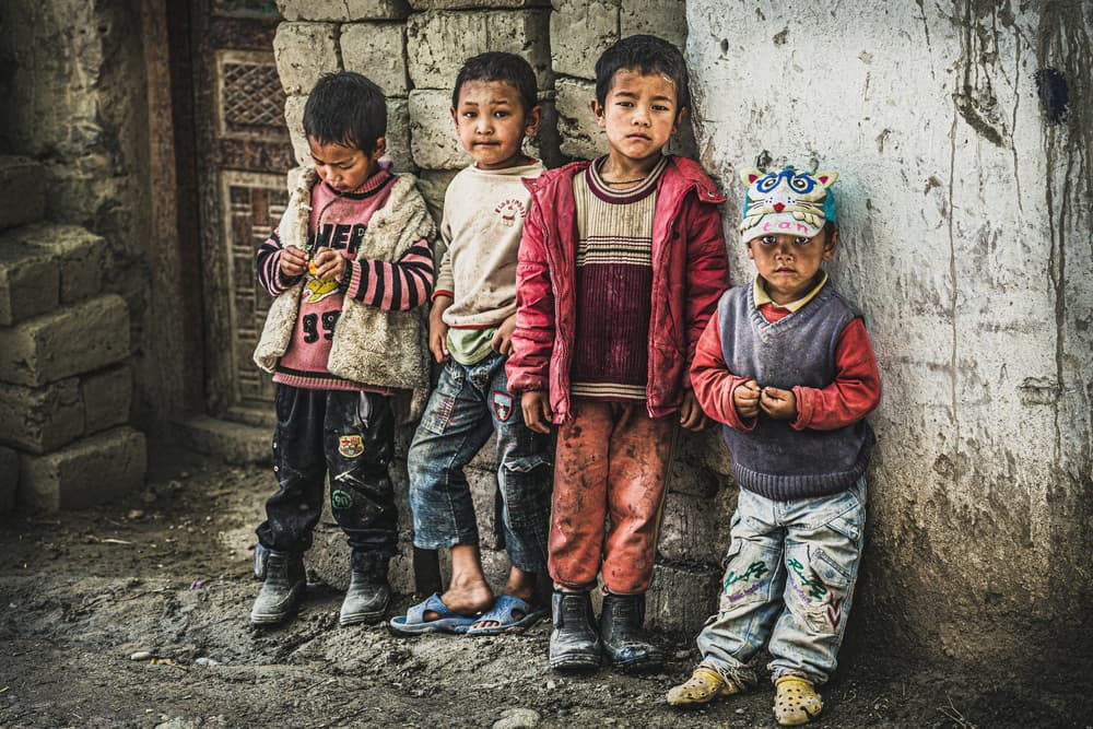 Pensive Village Children by Marco Tagliarino — canvas wall art