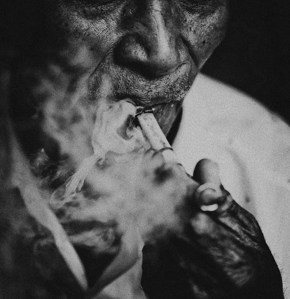 Old Man Smoking by Andi Halil — canvas wall art