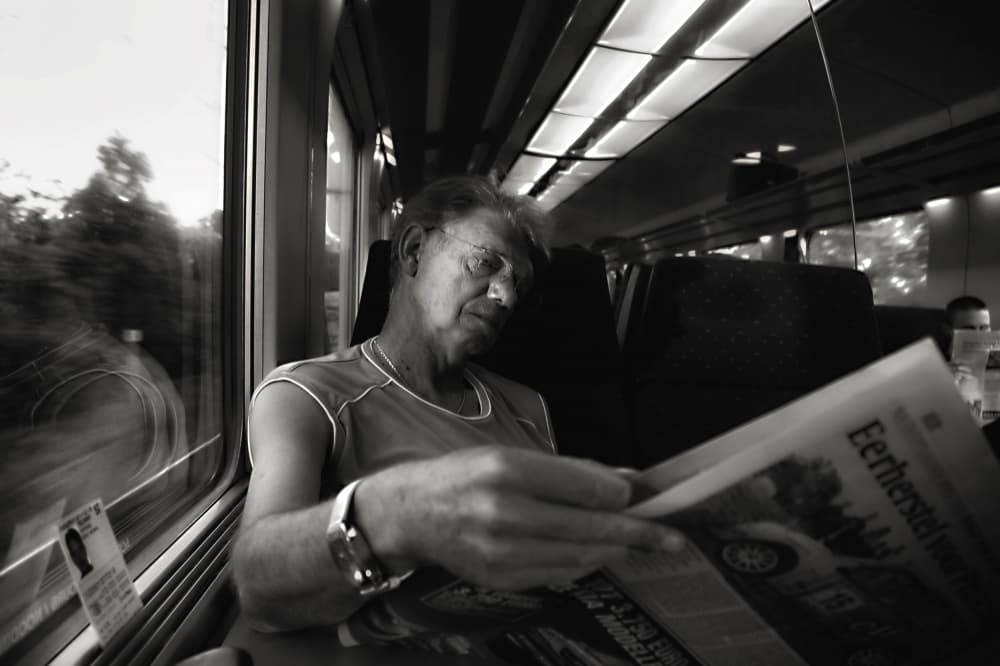 Man Reading On Train by Yvette Depaepe — canvas wall art