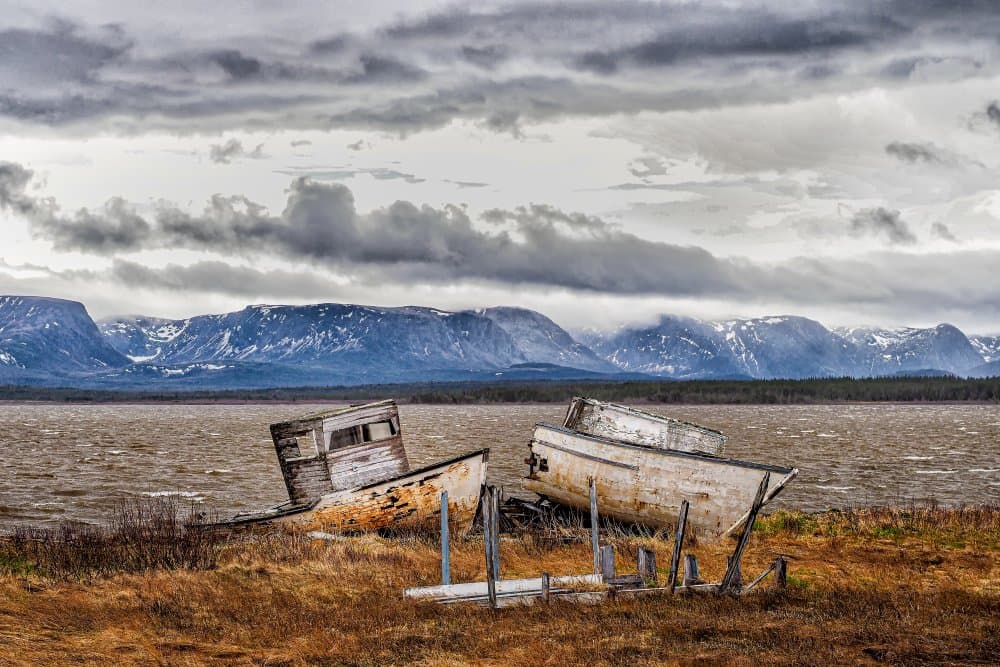 Weathered Boats Mountain Lake by Michel Groleau — canvas wall art