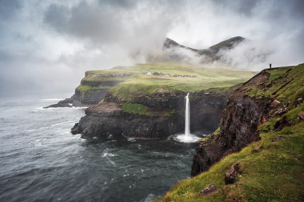 Misty Coastal Waterfall by Marc van Oostrum — canvas wall art