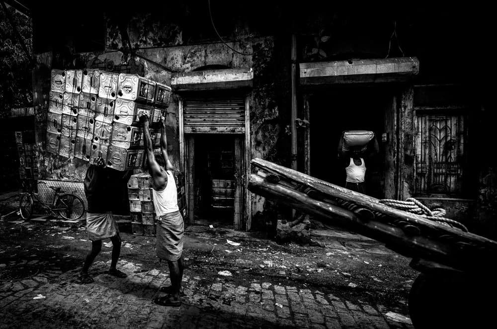 Urban Laborers Carrying by Joxe Inazio Kuesta Garmendia — canvas wall art