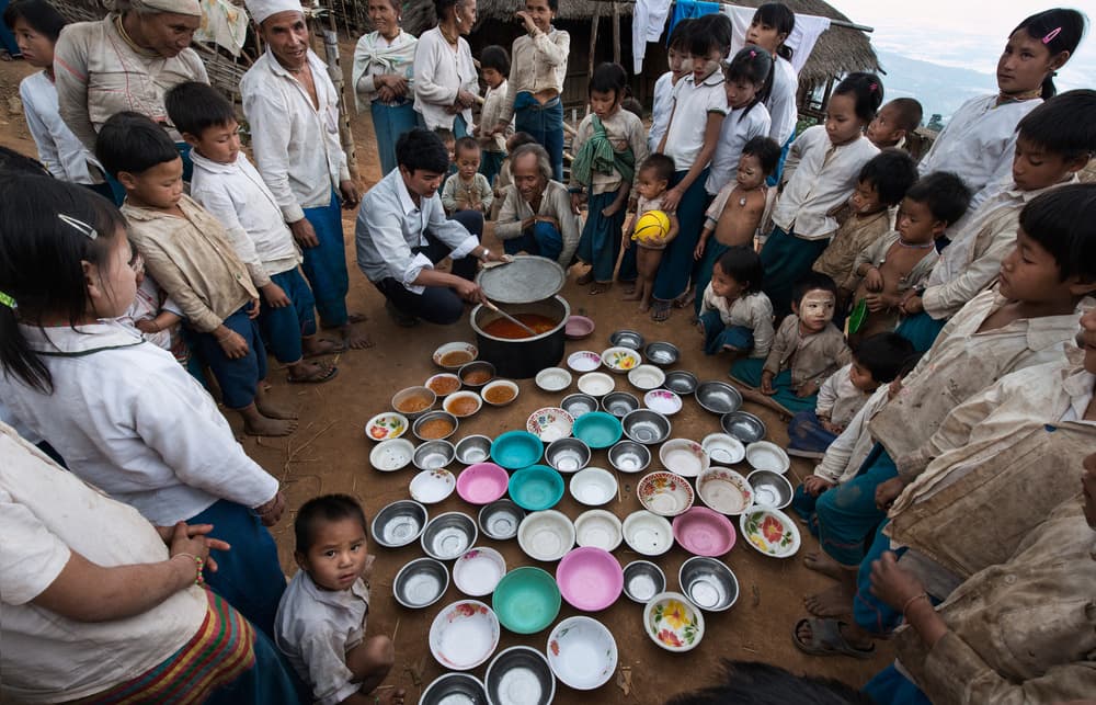 Village Meal Gathering by Joxe Inazio Kuesta Garmendia — canvas wall art
