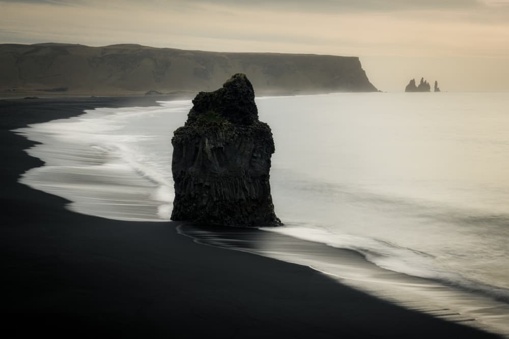 Moody Sea Stack Beach by Ionut Petrea — canvas wall art