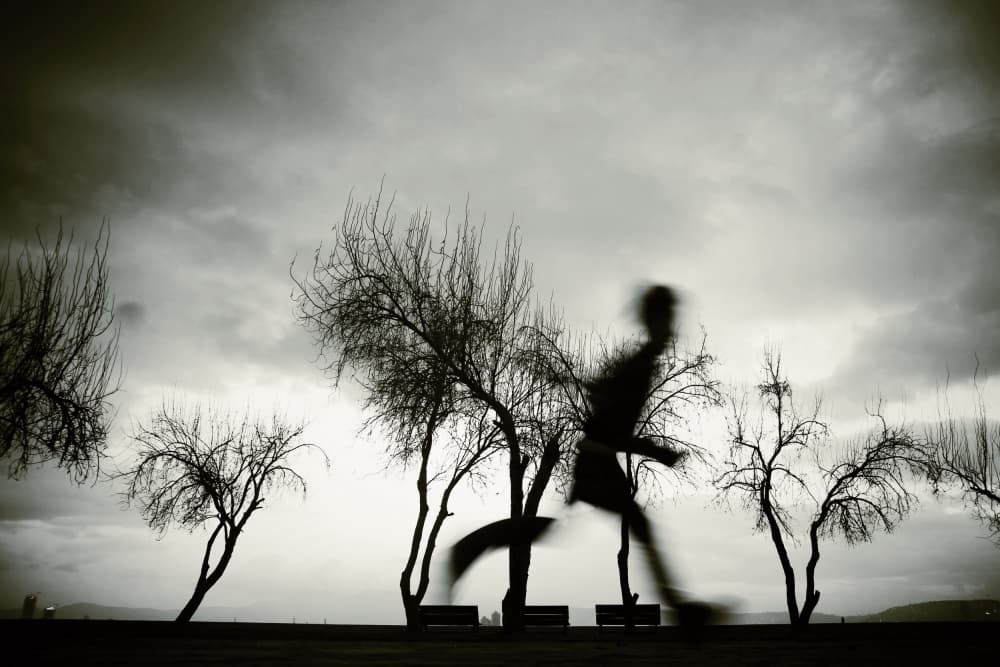 Lone Runner Dark Sky by Ali Ayer — canvas wall art