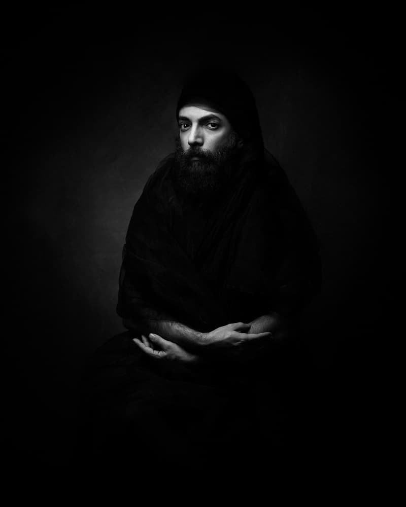 Contemplative Hooded Figure by Mehdi Mokhtari — canvas wall art