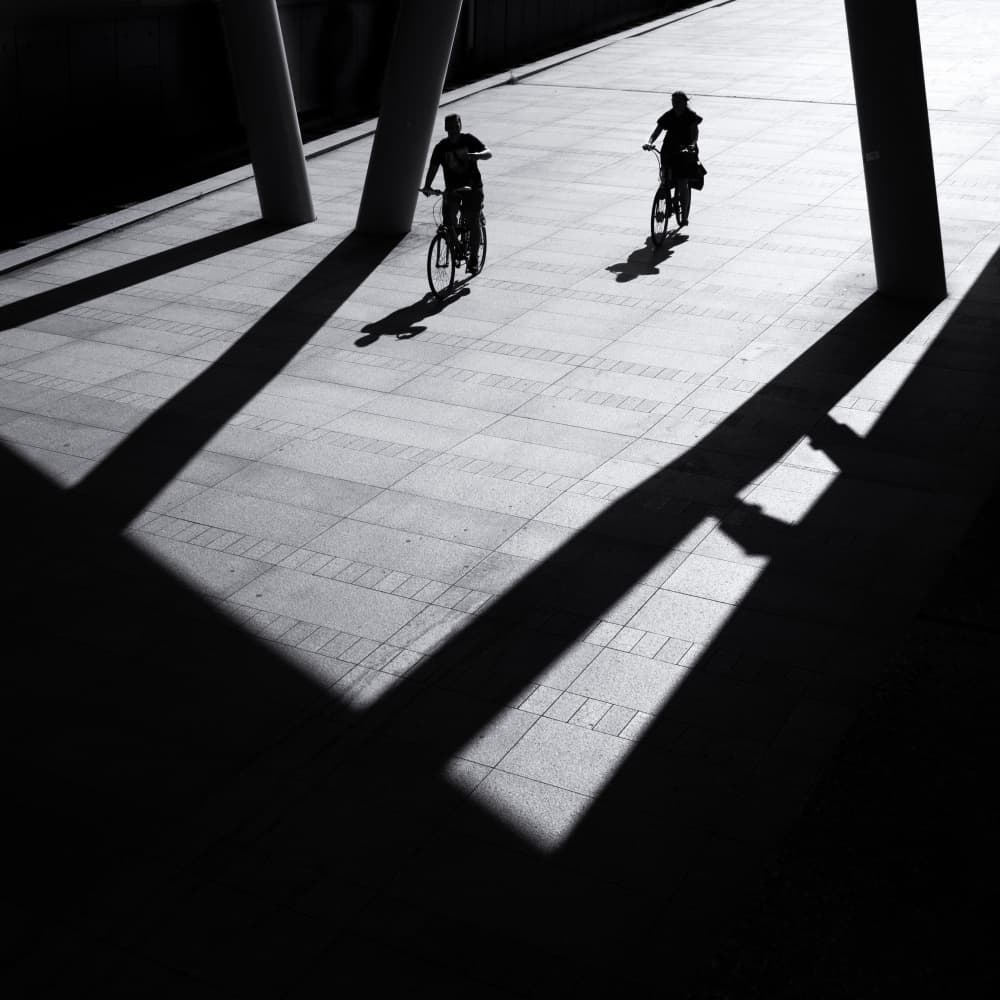Cyclists In Long Shadows by Rolf Endermann — canvas wall art