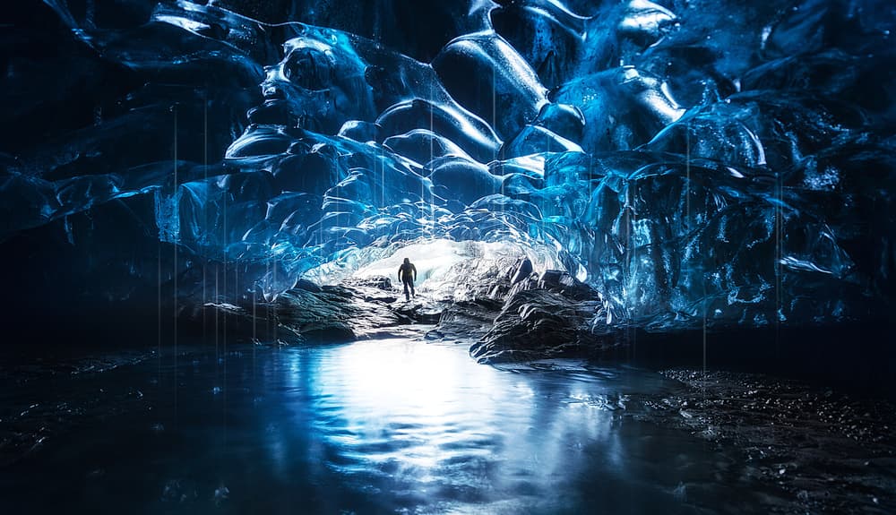 Blue Ice Cave Journey by David Martin Castan — canvas wall art