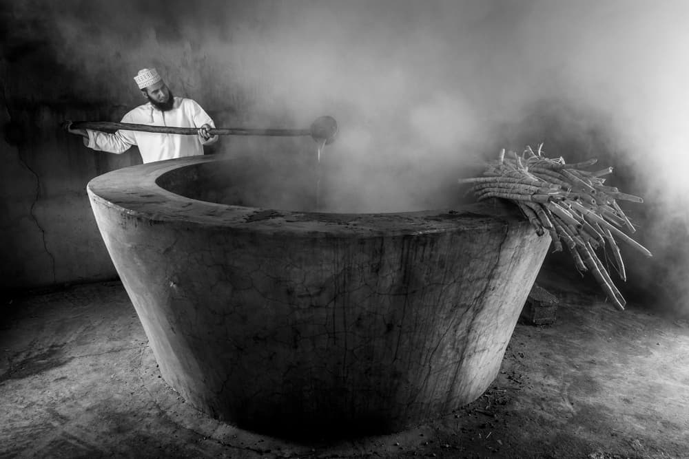 Artisan Stirring Hot Vat by Haitham AL Farsi — canvas wall art