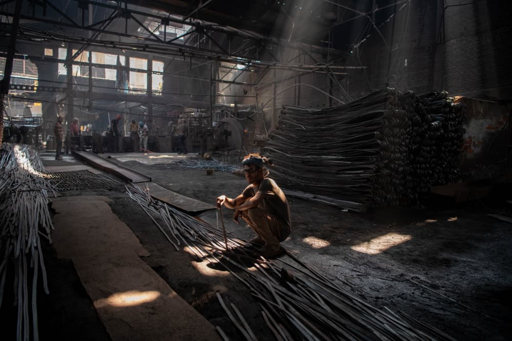 Worker In Factory Sunlight by Max Vere-Hodge — canvas wall art