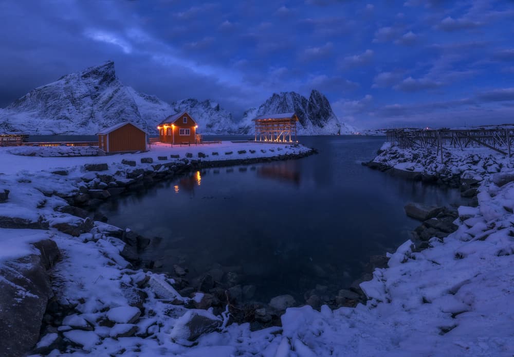 Snowy Fjord Village by Carlos Gonzalez — canvas wall art