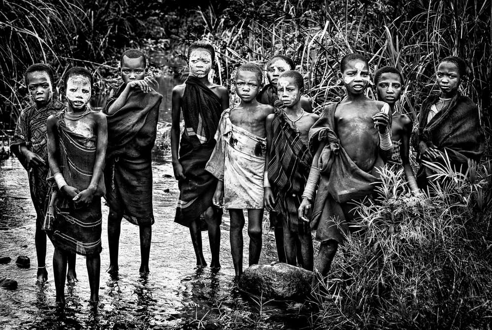Indigenous Children Standing by Joxe Inazio Kuesta Garmendia — canvas wall art