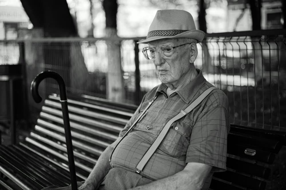 Old Man on Park Bench by Denis Malciu — canvas wall art