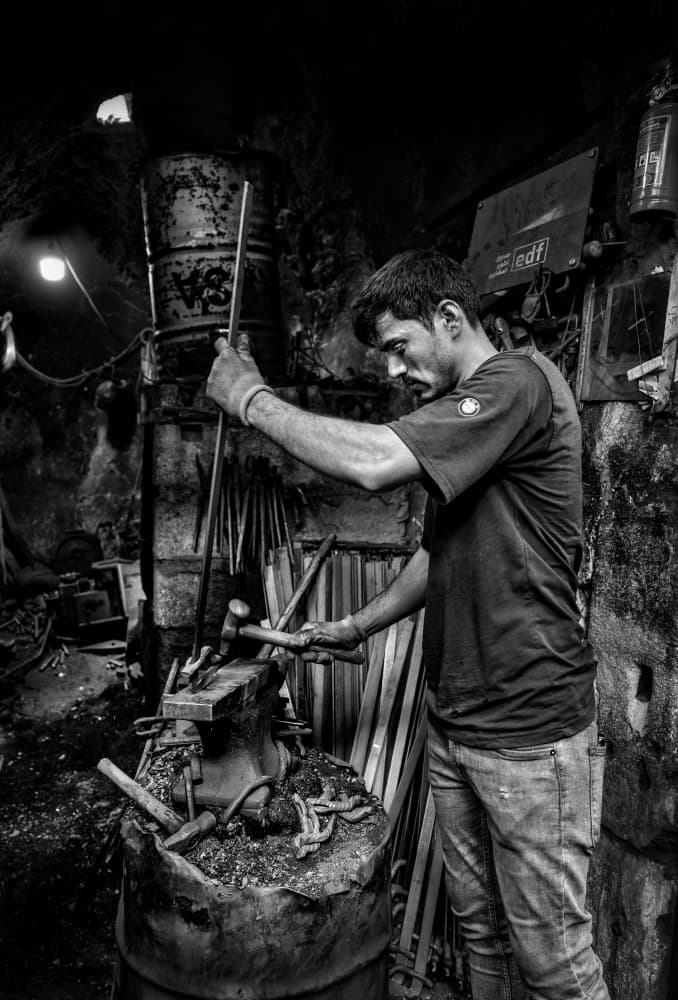 Artisan Forging Metal by Bashar Alsofey — canvas wall art