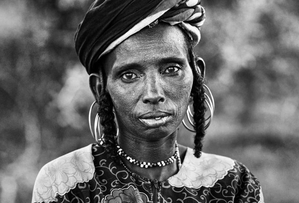 Woman With Tribal Earrings by Joxe Inazio Kuesta Garmendia — canvas wall art