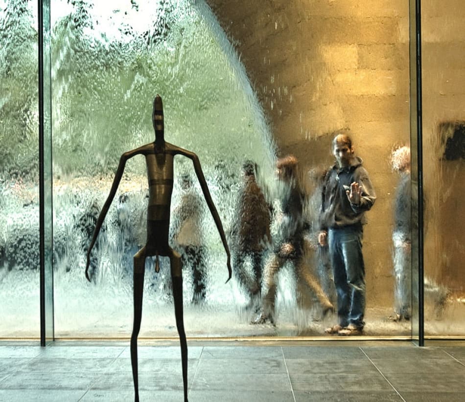 Man Behind Water Wall by Mel Brackstone — canvas wall art