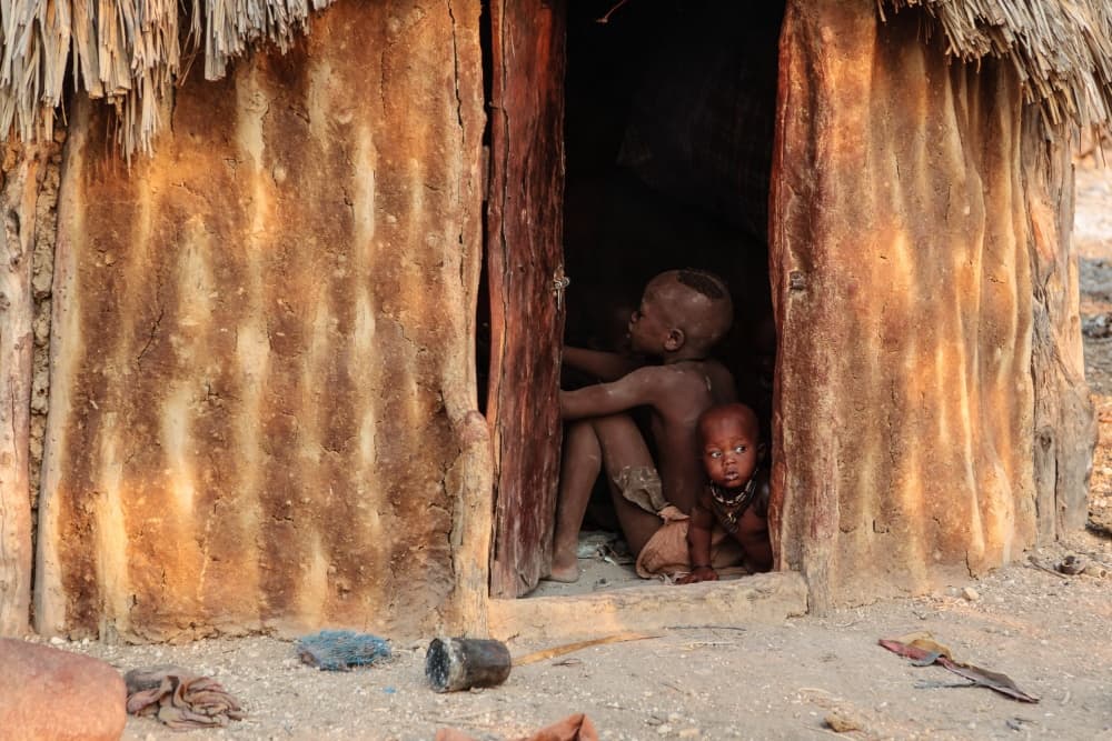 African Children in Hut by Franco Farinati — canvas wall art