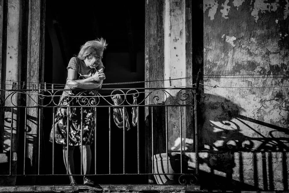 Elderly Woman Balcony Light by Koji Morishige — canvas wall art