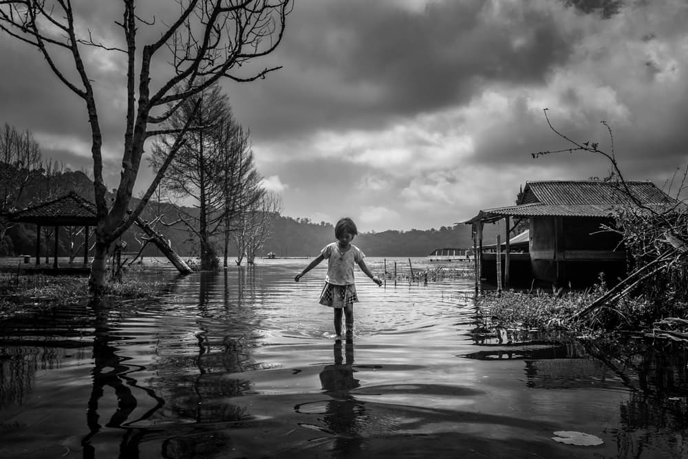 Child In Water Village by Gunarto Song — canvas wall art