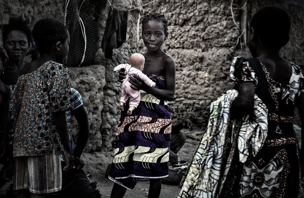 African Girl with Doll by Joxe Inazio Kuesta Garmendia — canvas wall art