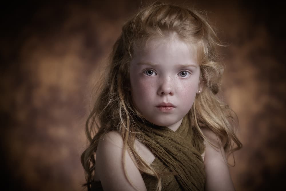 Young Girl's Serious Gaze by Carine Belzon — canvas wall art
