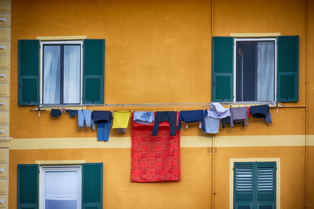 Yellow Building Clothesline by Paolo Bolla — canvas wall art
