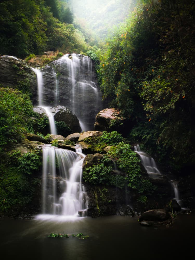 Misty Jungle Waterfall by Ryan Braxton — canvas wall art