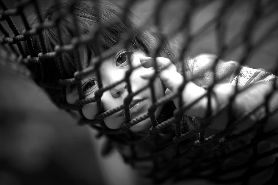 Thoughtful Child In Net by Carmit Rozenzvig — canvas wall art