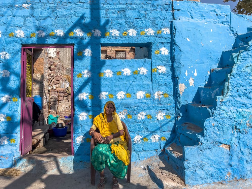 Indian Woman Blue House by Ilana Lam — canvas wall art