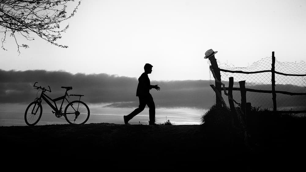 Man Bike Evening Silhouette by Marius Cinteza — canvas wall art