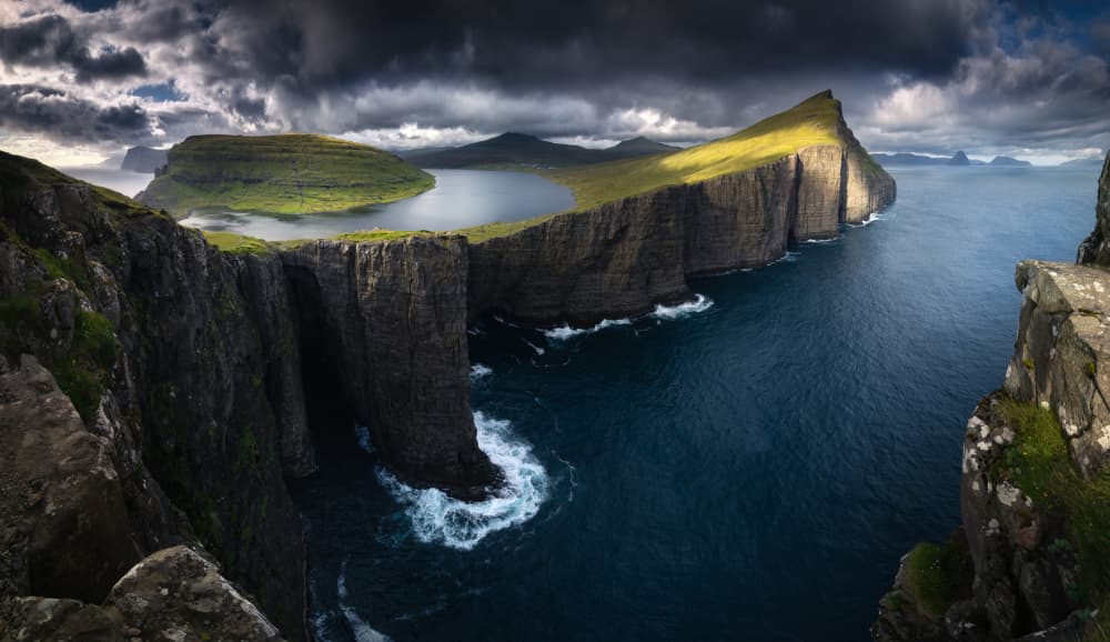 Dramatic Floating Lake Cliffs by Karol Nienartowicz — canvas wall art