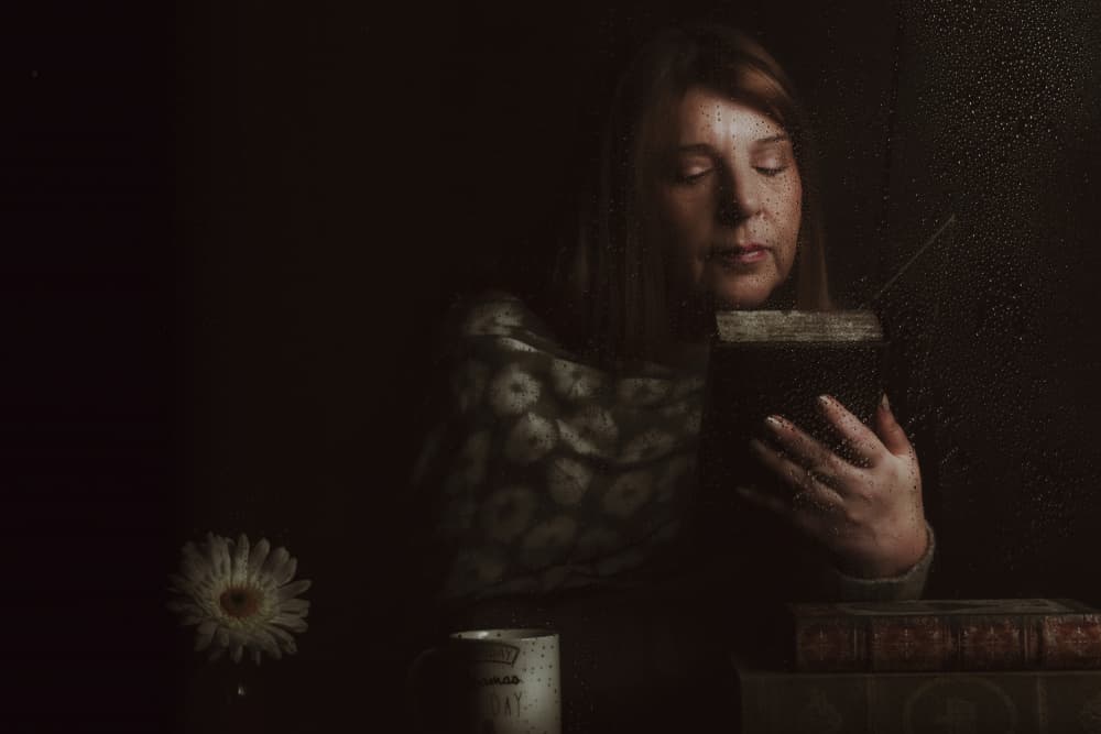 Pensive Woman Reading Book by Enrico Sottocorna — canvas wall art