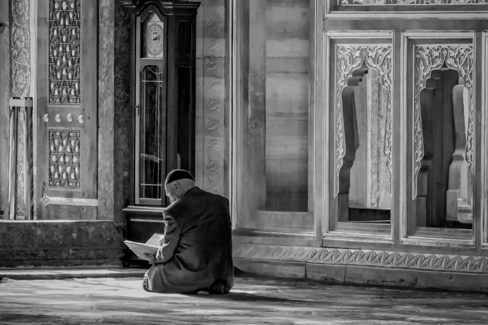 Man Reading Mosque Interior by Michel Groleau — canvas wall art