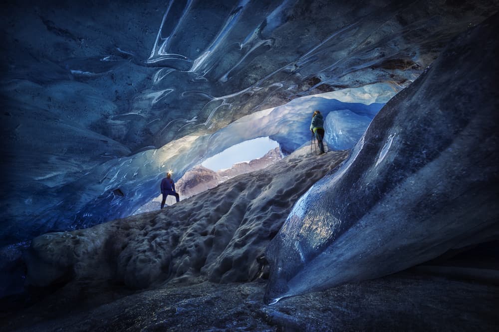 Exploring Blue Ice Cave by Clara Gamito — canvas wall art