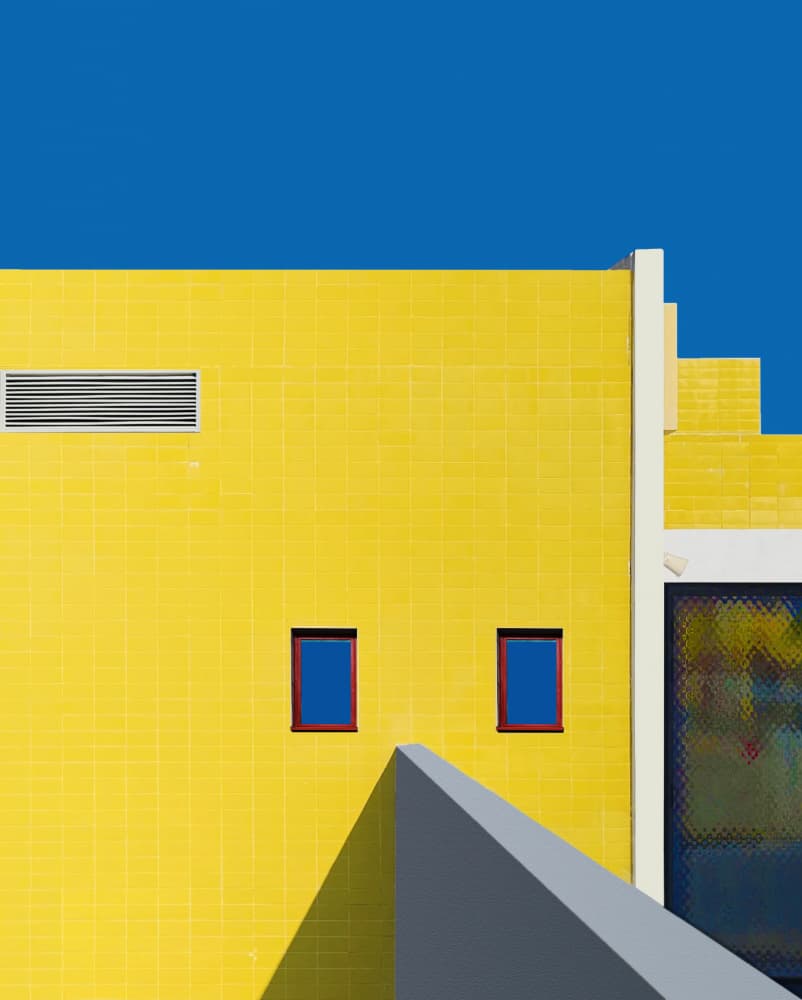 Yellow Building Blue Sky by Arnon Orbach — canvas wall art