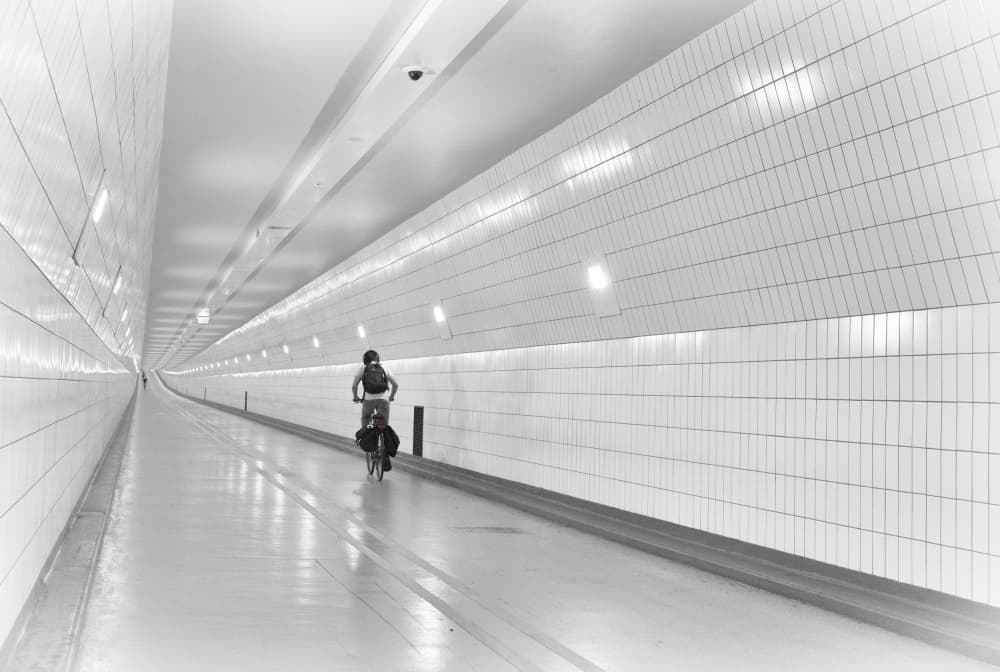 White Tunnel Cyclist by Greetje van Son — canvas wall art