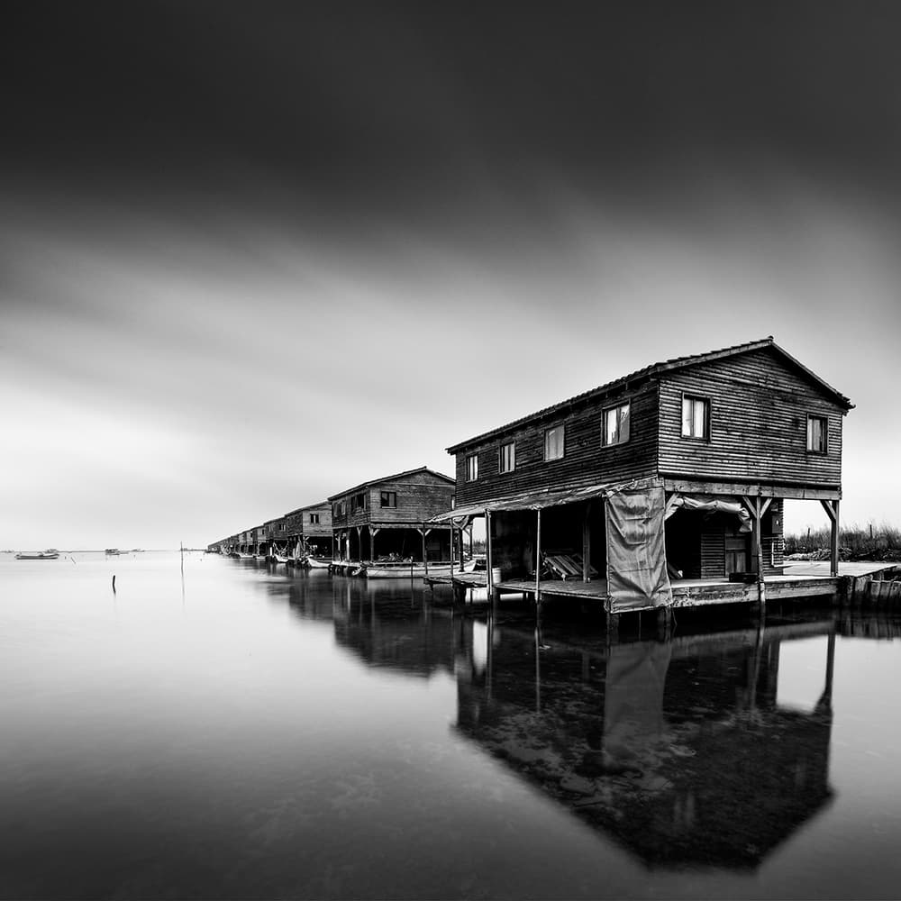 Serene Stilt House Reflections by George Digalakis — canvas wall art