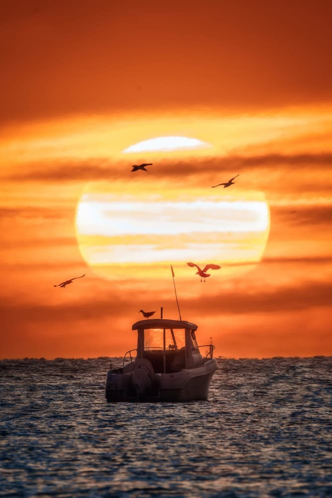 Orange Sunset Fishing Boat by Juan Luis Seco — canvas wall art