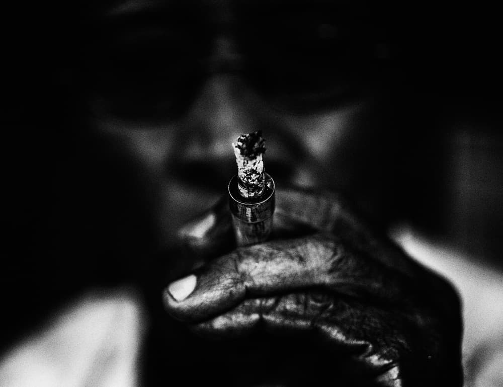Gritty Smoking Hand by Andi Halil — canvas wall art