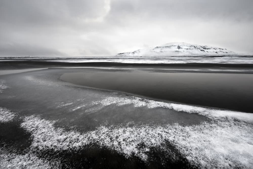 Snowy Black Beach by Liloni Luca — canvas wall art
