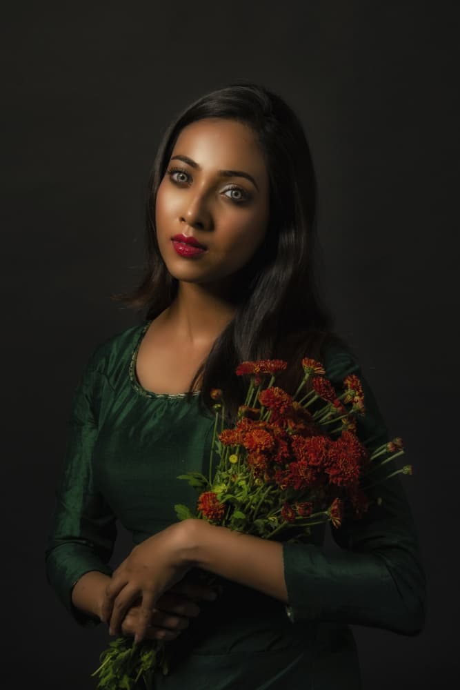 Elegant Woman With Flowers by PARTHA BHATTACHARYYA — canvas wall art